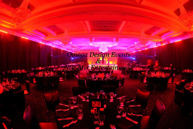 Corporate Event Hall setup with red lighting, black backdrops in Montreal Qc